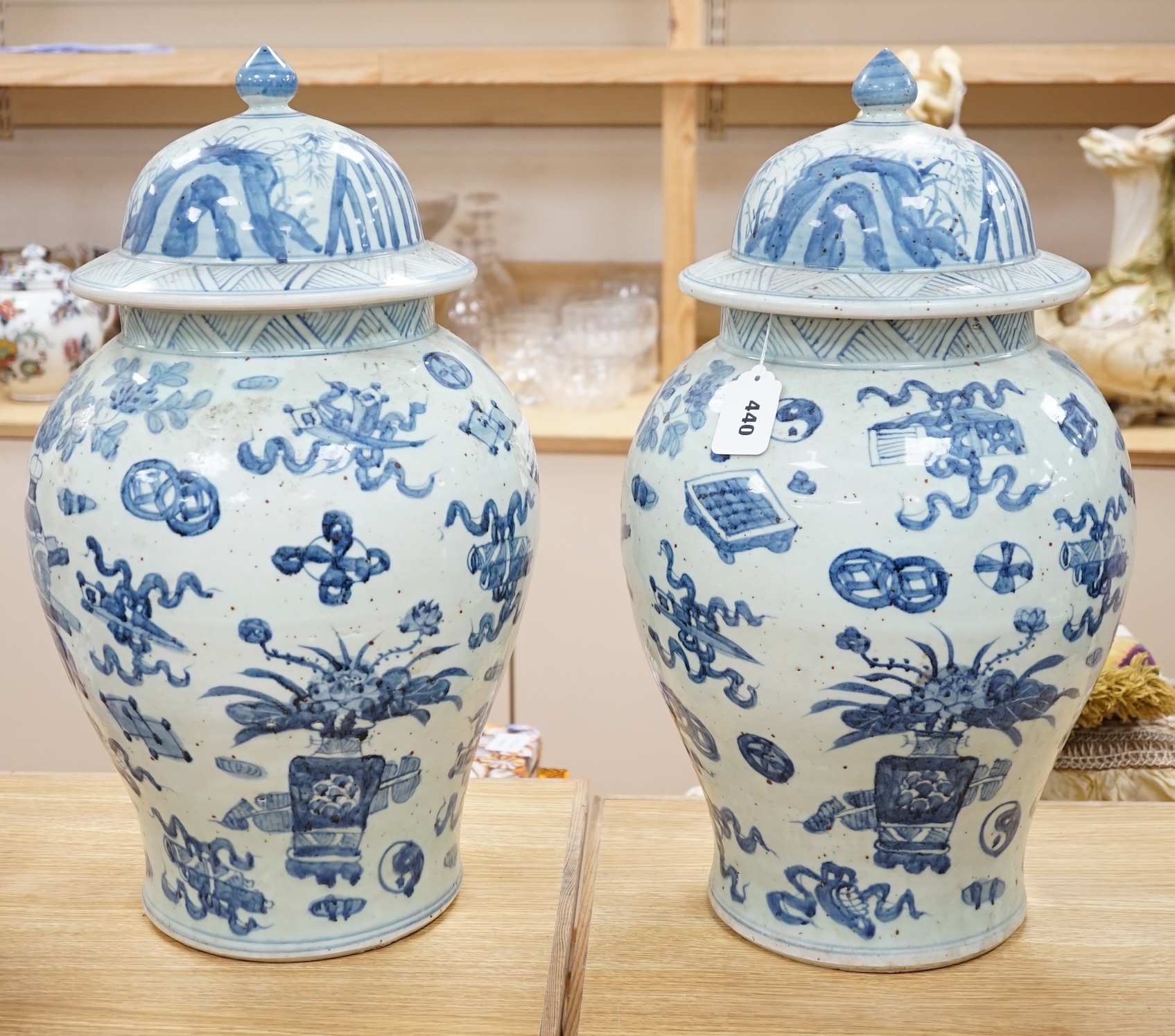 A large pair of Chinese blue and white ginger jars and covers, 54cm high. Condition - fair to good